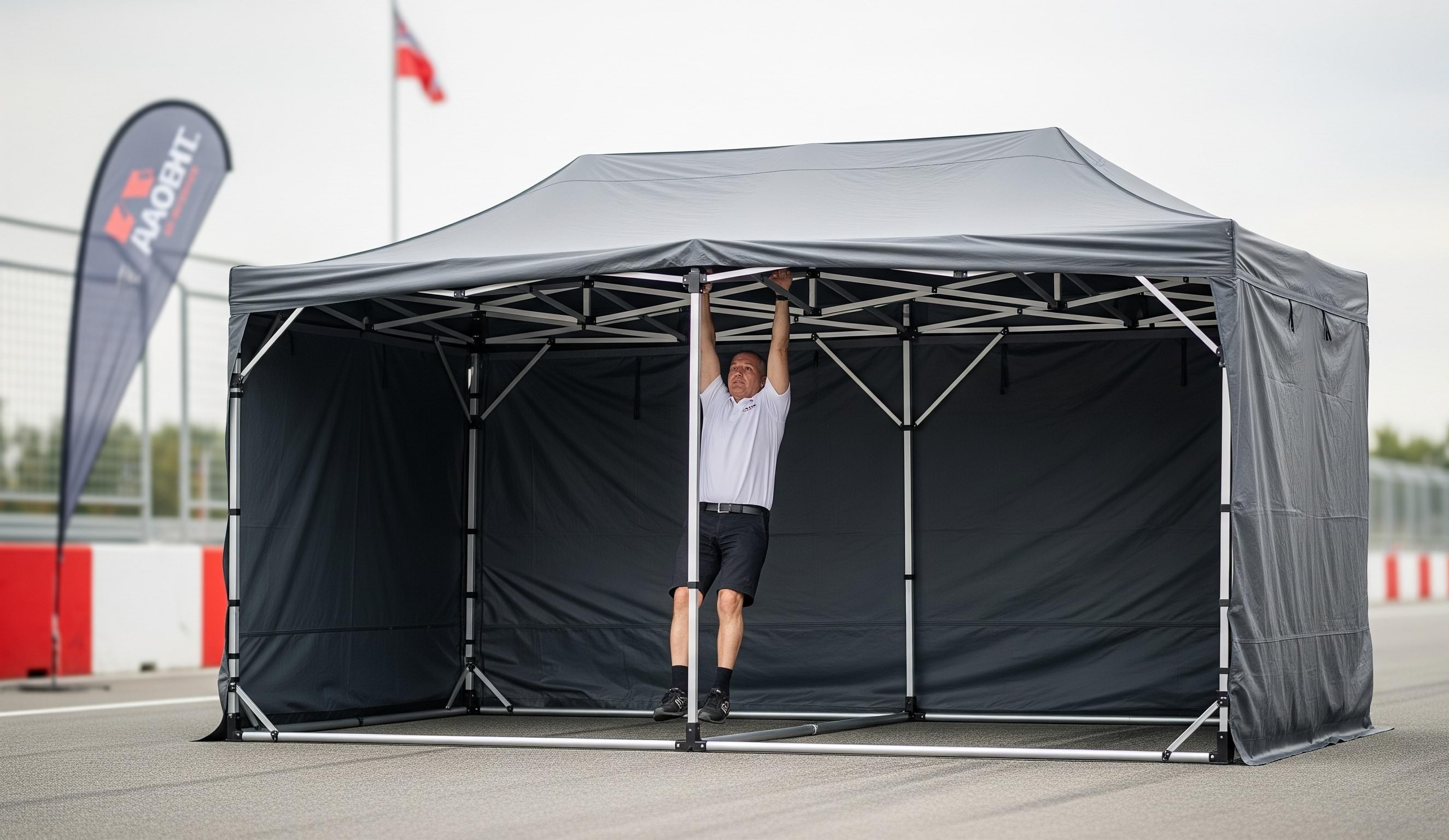 Tente pliante professionnelle ATB Barnum démontrant sa solidité et sa robustesse.